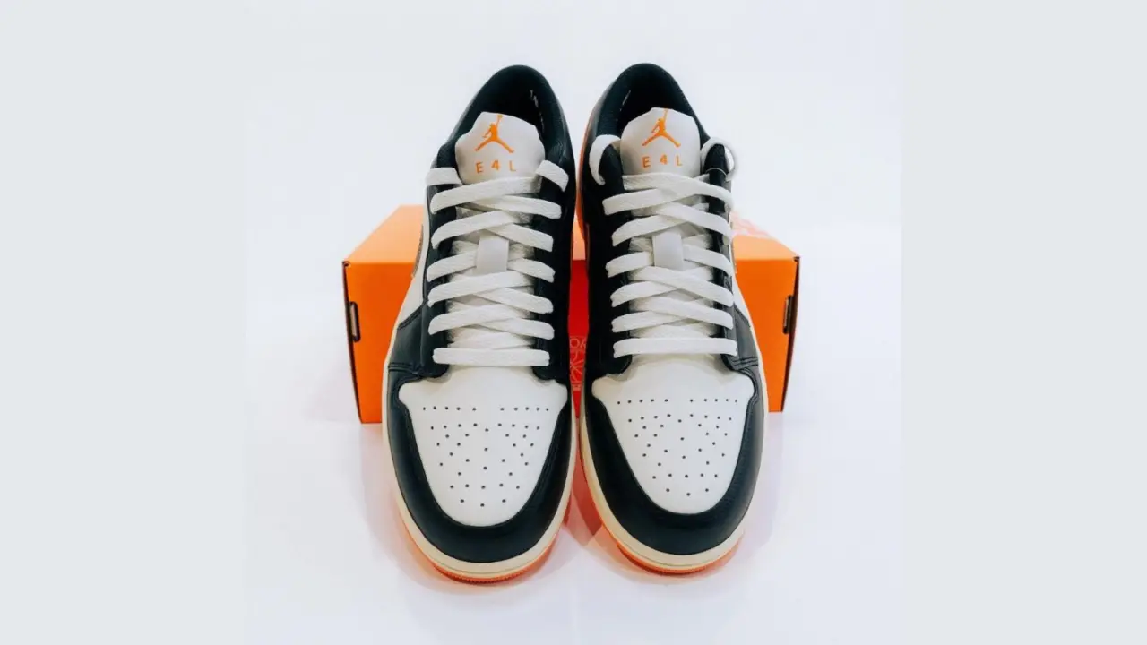Hinh anh 3: Air Jordan 1 Low EKIN: Doi giay gioi han voi phoi mau den, trang, cam va logo Nike viet nguoc, chi danh rieng cho EKIN cua Nike.