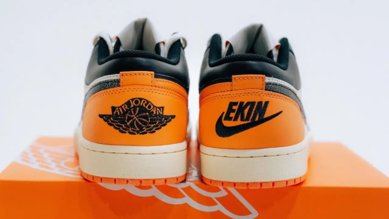 Hinh anh 5: Air Jordan 1 Low EKIN: Doi giay gioi han voi phoi mau den, trang, cam va logo Nike viet nguoc, chi danh rieng cho EKIN cua Nike.