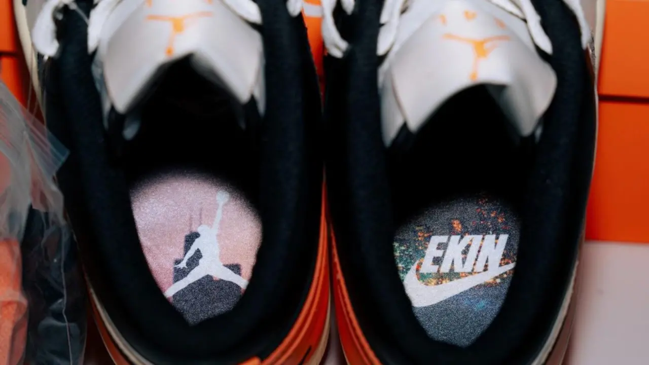 Hinh anh 2: Air Jordan 1 Low EKIN: Doi giay gioi han voi phoi mau den, trang, cam va logo Nike viet nguoc, chi danh rieng cho EKIN cua Nike.